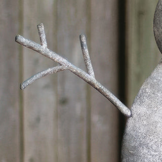 Natural twig arms detail on vintage white metal snowman outdoor Christmas decoration