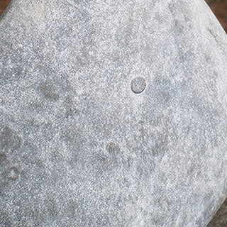 Textured distressed white-washed finish on metal snowman showing authentic weathered patina and button detail