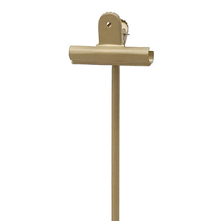 Close-up of gold metal clip mechanism on adjustable photo display stand