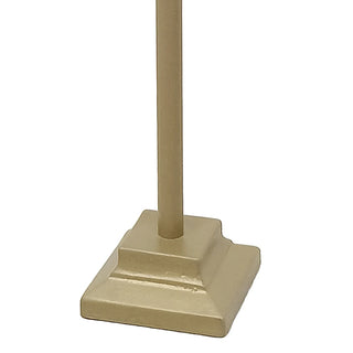 Detailed view of tiered square base on gold metal picture holder