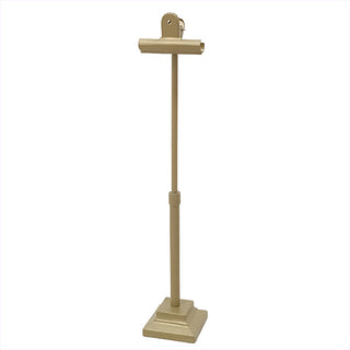 Full view of gold metal photo stand showing adjustable height and clip-style holder