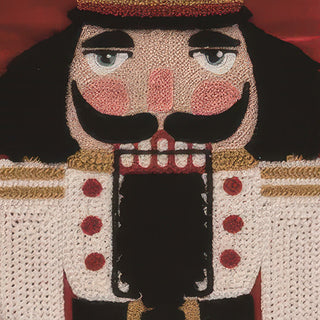 Close-up embroidered nutcracker face detail