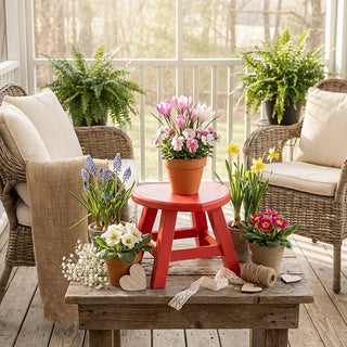 Red heart wooden stool styled with spring floral decor
