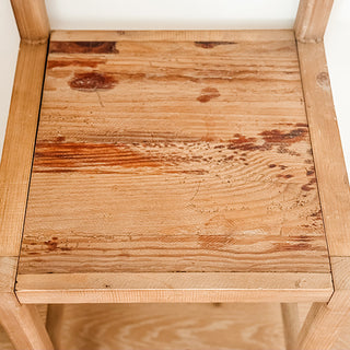 Reclaimed wood bar stool seat detail weathered finish unique grain pattern