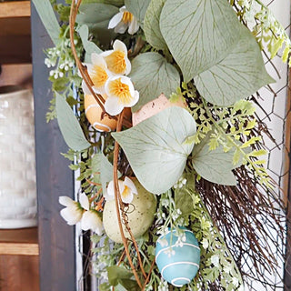Faux greenery and Easter eggs spring decor detail