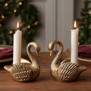 Elegant antique gold swan taper candle holders set of 2 with detailed feather design for holiday dining table