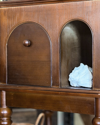 Arched door storage table open showing interior shelf