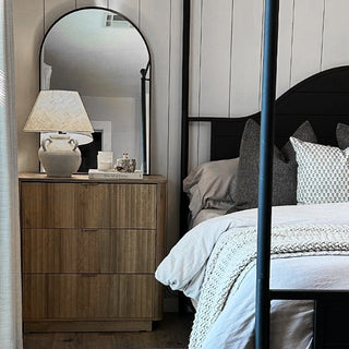 Farmhouse ceramic lamp on modern wood dresser