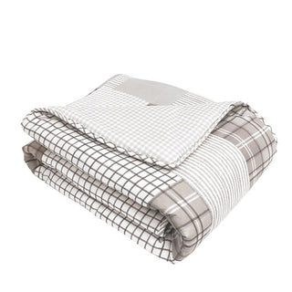 Folded gray patchwork throw blanket product shot