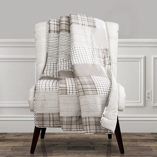 Modern patchwork throw blanket styled on accent chair