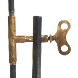 Detail of decorative brass key mechanism on hourglass stand