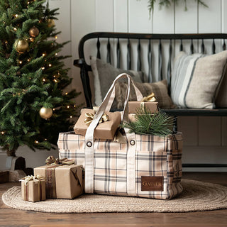Woman holding plaid tote filled with wrapped gifts near Christmas tree in festive bedroom