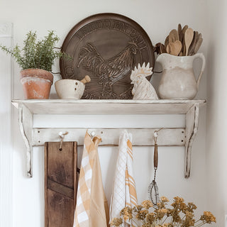 Rustic farmhouse shelf with copper rooster wall decor