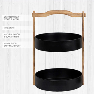 Two tier wood and metal serving stand with dimensions 12 inches diameter by 19 inches height showing natural wood finish and black metal construction