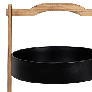 Close up detail of arched natural wood handle on modern two tier black metal serving tray stand