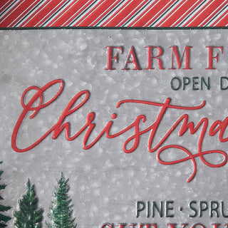 Close-up detail of Farm Fresh Christmas Trees script lettering on galvanized metal tray with evergreen tree artwork