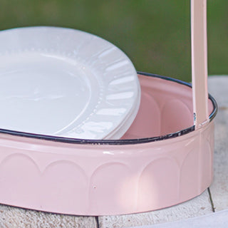  Detail shot of distressed blush pink finish and scalloped edge on two-tier metal serving tray