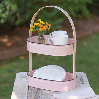 Full view of blush pink two-tier metal tray with arched handle showing both serving levels and farmhouse style