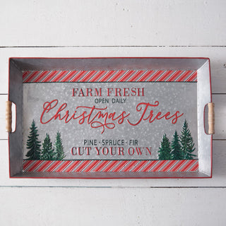 Full overhead view of rectangular Farm Fresh Christmas Trees metal serving tray with candy cane striped border and wood handles