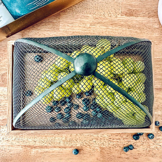 Overhead view mesh covered fruit tray
