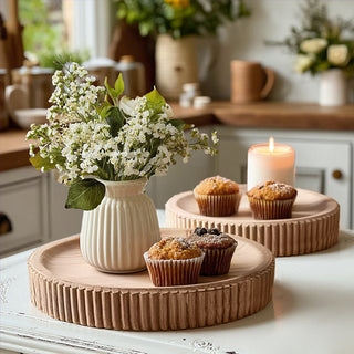 Round wooden tray with flowers and muffins decor