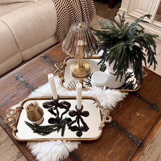 Antique gold mirrored tray styled on coffee table