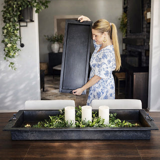 Distressed black metal centerpiece tray set of two on farmhouse dining table with candles and greenery