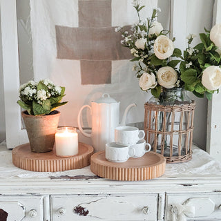 Close-up wooden tray with candle and potted plant