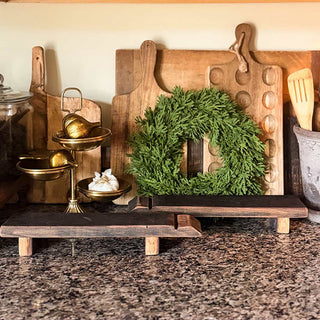 Reclaimed wood serving risers styled on farmhouse kitchen counter