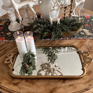 Gold mirrored tray used as holiday table decor