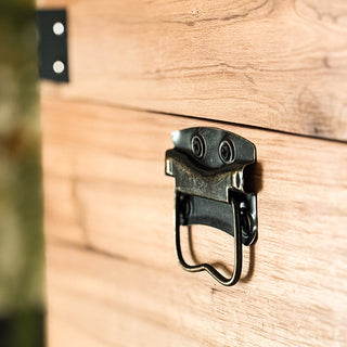 Stacked set of three carved wooden storage trunks with geometric panel detailing and metal hardware