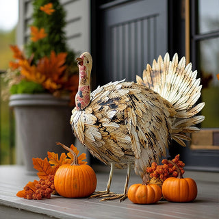 Outdoor metal turkey decor with pumpkins and fall foliage