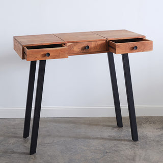 Mango wood vanity desk with all three drawers open displaying deep storage capacity black metal knob pulls and solid wood construction