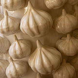 Close-up of ceramic garlic vase showing realistic clove texture for rustic home or kitchen display
