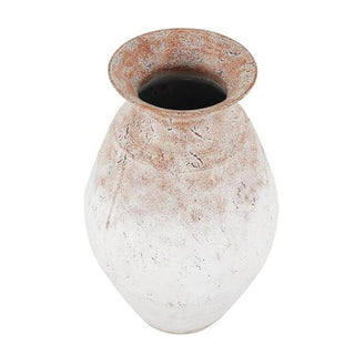 Close-up of distressed white vase rim showing textured finish and rustic details