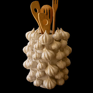 Ceramic garlic vase with wooden kitchen utensils, perfect for farmhouse or rustic kitchen countertop