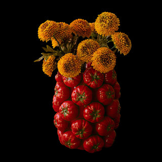 Ceramic tomato vase with yellow flowers, decorative kitchen accent inspired by fresh garden produce