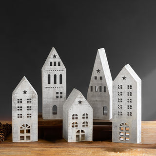  Full set of five distressed white wooden village houses arranged by height showing variety of designs for Christmas mantel display