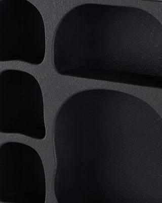 Textured Black Wall Shelf with Arched Shelving Design