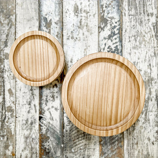 Wood risers styled with plant and candle decor