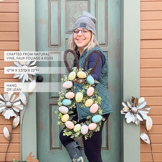 Woman holding Easter egg wreath spring decor