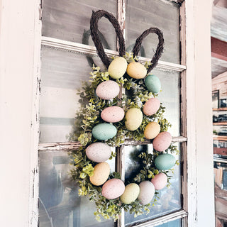 Bunny-shaped Easter wreath with pastel eggs