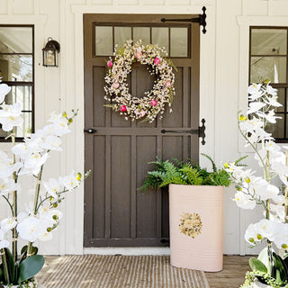 Farmhouse spring porch decor with floral wreath