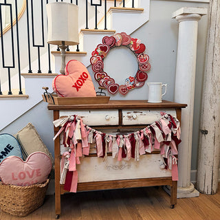 Valentine wreath home decor vignette with garland