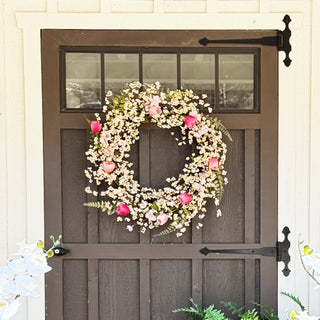 Pink berry spring wreath on rustic door