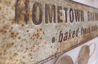 Embossed Metal Baking Sign with Rusted Patina